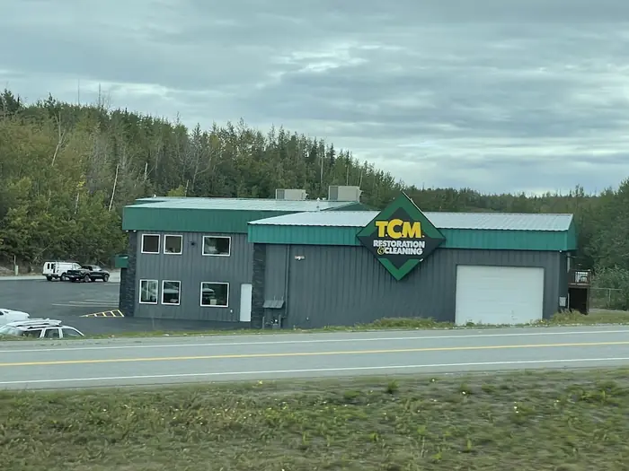 TCM Restoration facility building with company signage